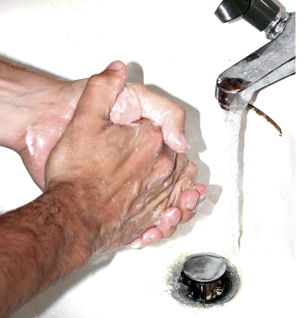A person with obsessive compulsive disorder washing hands